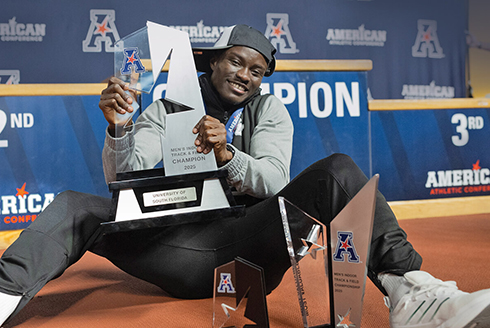 Abdul-Rasheed Saminu holds his Track and Field trophy