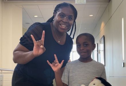 Dr. Sherrise Bryant, associate professor of instruction, stopped by the conference with her son Mark Bryant