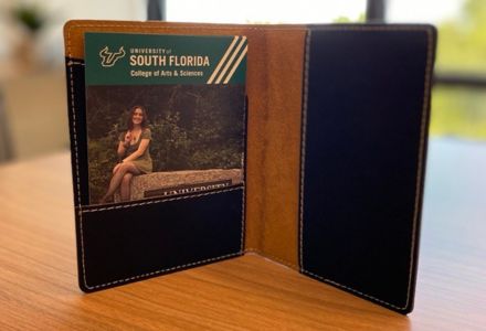 Custom passport covers and cards featuring CAS study abroad student experiences. (Photo by JWS Photography)