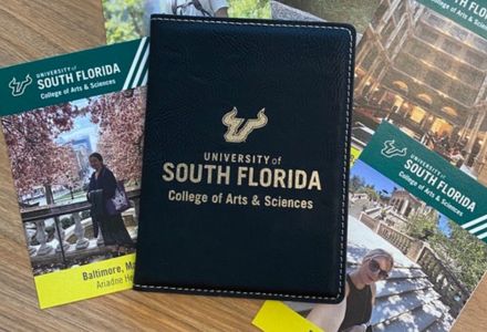 Custom passport covers and cards featuring CAS study abroad student experiences. (Photo by JWS Photography)