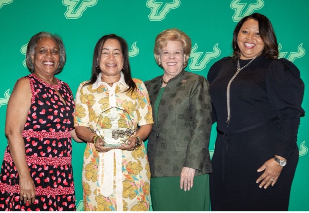 Mifflin (second from left) poses with USF President Rhea Law (third from left) during 2023 Joyce Russell Kente Awards and Scholarship Ceremony. (Photo courtesy of USF Alumni Association)