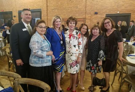 Rodriguez-Rogers (third from the left) with USF President Judy Genshaft (4th from the left) and her mother (second from the left), along with business and community leaders at an event. (Photo courtesy of Aileen Rodriguez-Rogers)