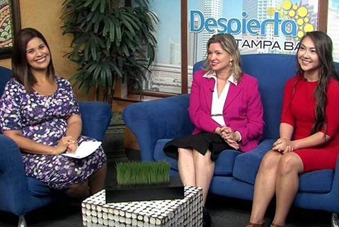 Rodriguez-Rogers (middle) and her mentee Yoana Cardoso (right), being featured on the Latin broadcast channel Despierta Tampa Bay with news anchor Sarykarmen Rivera (left). (Photo courtesy of Aileen Rodriguez-Rogers)