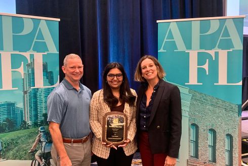 MURP graduate student Beneetta Mary Jose (center) at APA award ceremony. (Photo courtesy of APA Florida)