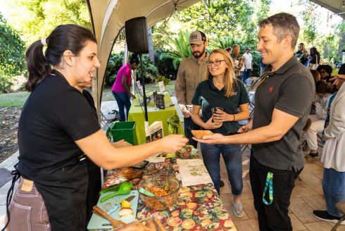 Attendees visit tabling organizations for tastings, networking, and educational engagement. (Photo by JWS Photography)