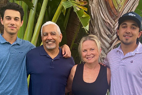 Dr. Ravi Randhawa and Christine Randhawa (center) with their two sons, Liam and Colin.
