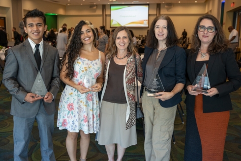 USF College of Arts and Sciences congratulated four awardees at this year’s Status of Latinos (SoL) Hispanic Heritage Month awards ceremony. (From left) Elvis Rodriguez, Barbara Herrera, CAS Interim Dean Magali Michael, Dr. Susan Mooney, and Dr. Natalie Scenters-Zapico. (Photo by Corey Lepak)
