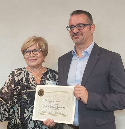 Dr. Davide Tanasi (right) accepts the GCICS’s Italian American of the Year award. (Photo courtesy of GCICS)
