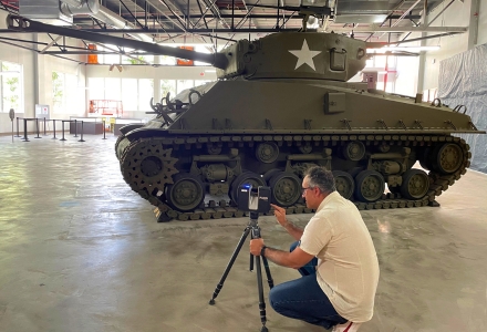 IDEx staff member 3D digitizing via terrestrial laser-scanning the American M-4A3E8 Sherman Tank with the markings of the 20th Armored Division, 9th Tank Battalion, Bravo Company, 1st Platoon, and 4th Vehicle. These were the type of tanks that participated in the liberation of Dachau. (Photo courtesy of Dr. Davide Tanasi)