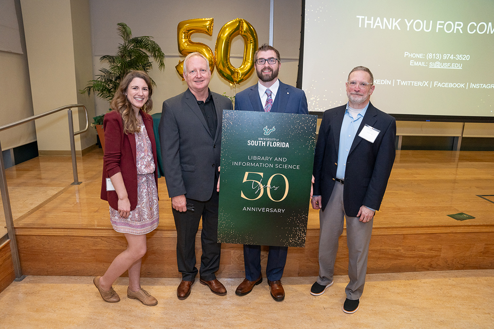 (From left) LIS program director Natalie Taylor, associate director of the iSchool Jim Andrews, department operations manager David Chapel, and iSchool director Randy Borsum at the 50th anniversary event. (Photo by Corey Lepak)