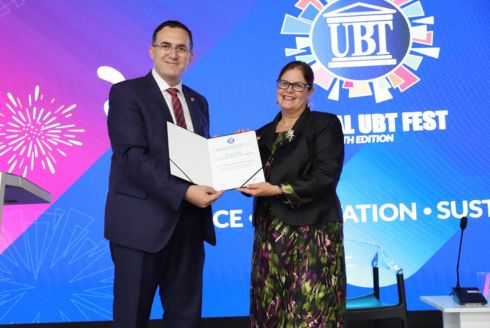 Dr. Judithanne Scourfield McLauchlan (right) receives the Leadership Excellence Award from UBT Rector Edmond Hajrizi (left). (Photo courtesy of Judithanne Scourfield McLauchlan)