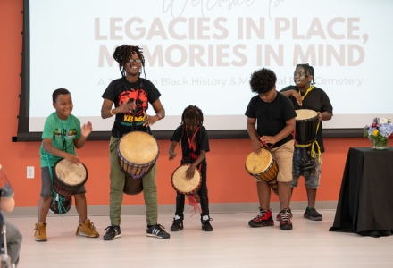 USF alumna Lakeema Matthew (second from left) and students from the Lina Bean Academy opened the presentation with a drumming exhibition. (Photo by Corey Lepak)