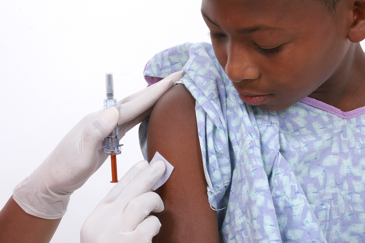 girl receiving vaccine shot