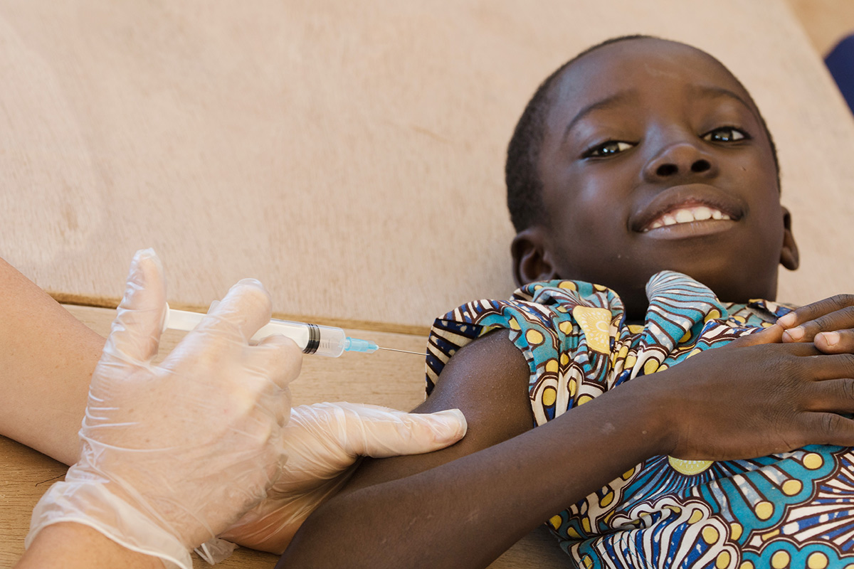 smiling child receiving vaccination