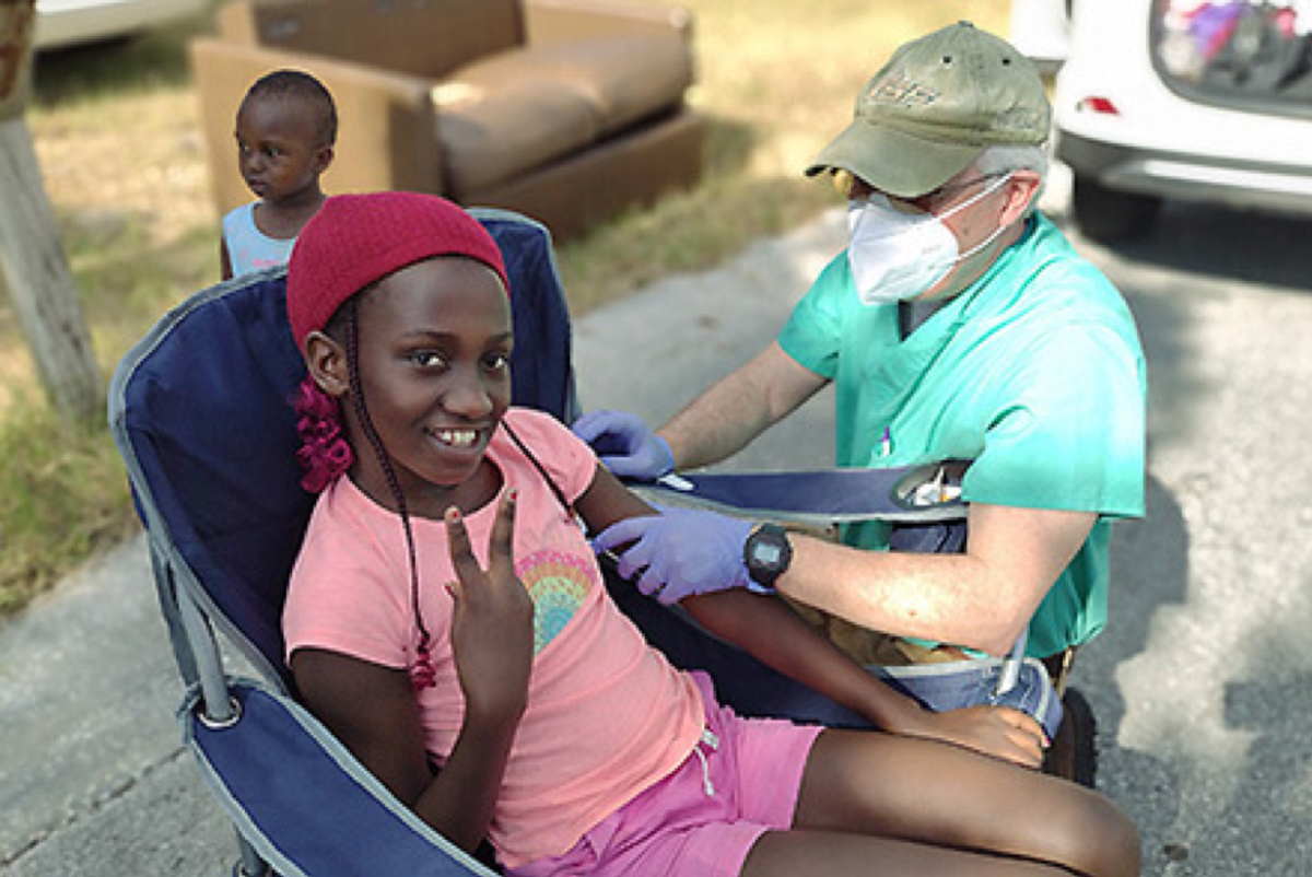 young girl receiving vaccine