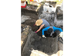Undergraduate students at Dr. Wallman’s 2018 Archaeological Field School excavate a large privy feature uncovered during previous field work