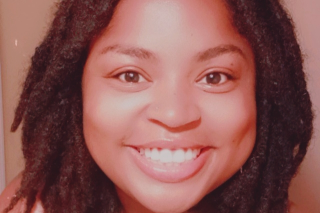 Headshot of Jade Jemison smiling into the camera