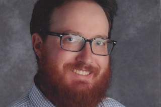 Headshot of Thomas Page smiling