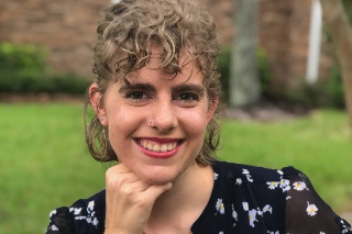 Headshot of Sarah Harder smiling into the camera