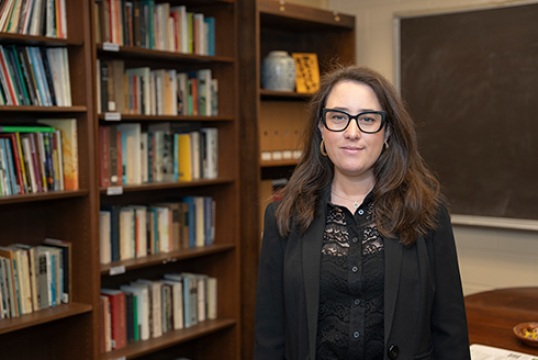 Natalie Scenters-Zapico stands in Michael Kuperman Memorial Poetry Library (Photo by Corey Lepak)