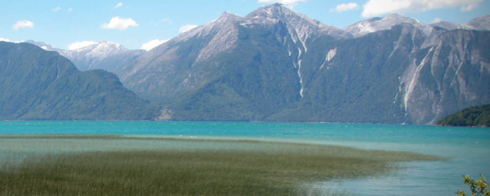 a moutain range with a lake sitting below it