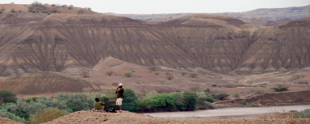 two students looking over mountain