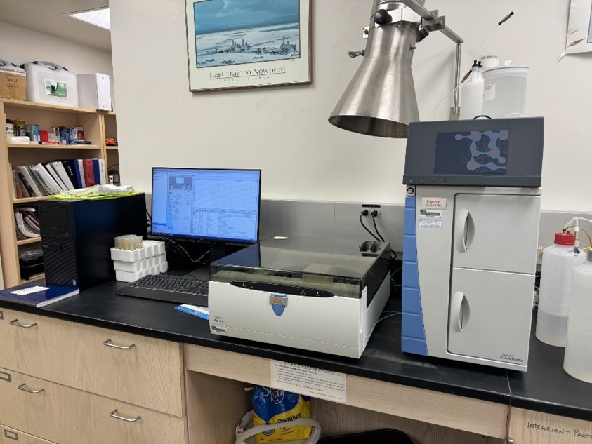 lab equipment on black lab desk. 
