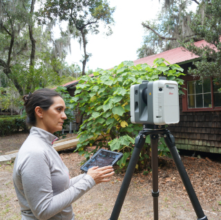 Geography student surveys a site of interest.