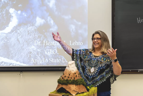 Photo of Dr. Heather Lehto smiling while lecturing