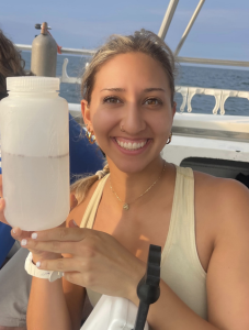 woman holding drink in picture smiling