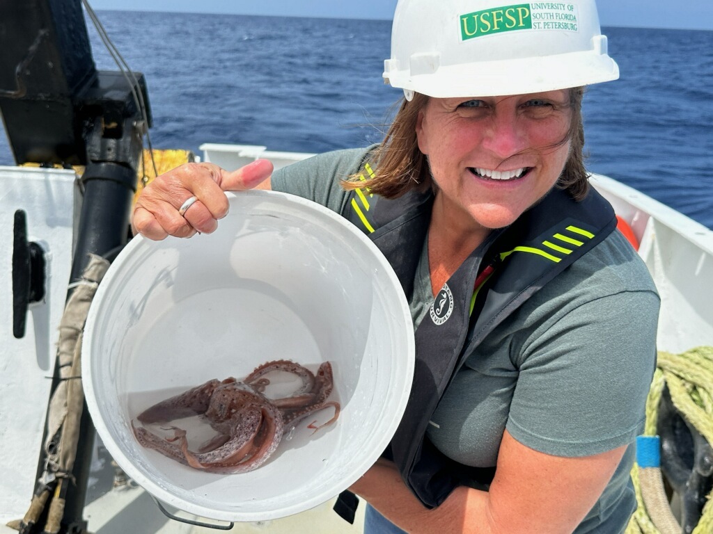 Heather Judkins holds bucket with encephelopod