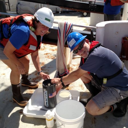 Heather and man working in hardhats