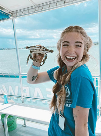 Jordan Dilena holding a crab