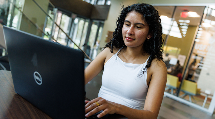 student girl working on laptop