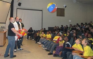 group presenting to students in auditorium