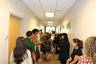 Attendees in the poster hallway