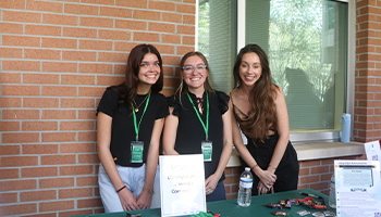 Attendees around the information tables