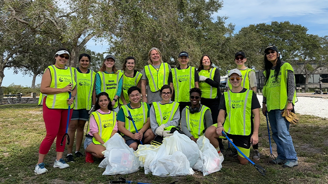 Diversity committee members beach clean up