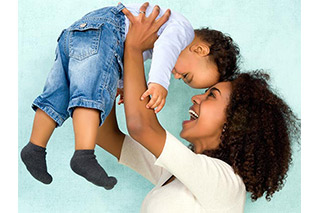 Mother playing with toddler son