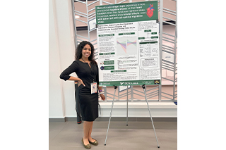 Susan Rodriguez with poster