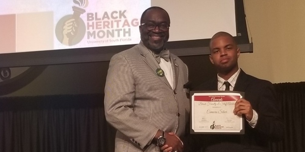 Camara Silver accepting award.