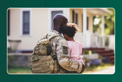 Daughter hugging her father who is in the military