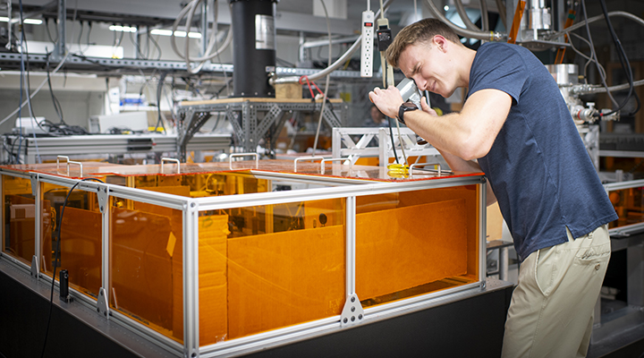 man working with scientific equipment - photo by Lisa Shorts