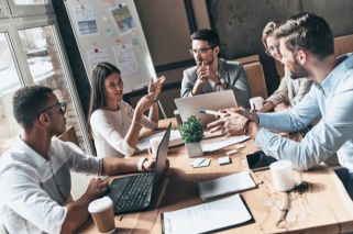 people sitting around a table talking