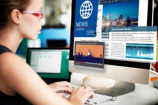 woman looking at computer monitor