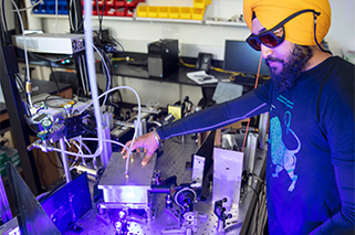 man in goggles performing experiment