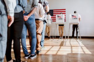 people standing in line to vote