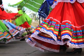 detail of dresses on traditional latin dancers