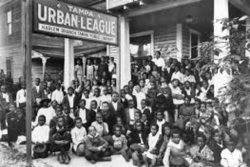 Children and staff in front of Tampa Urban League, Harlem Branch Library Tampa Public Library: Tampa, FL 1923. Photo from Tampa-Hillsborough County Public Libraries