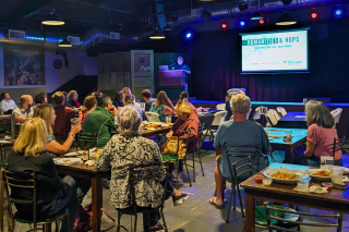 Audience seated at New World Music Hall venue 